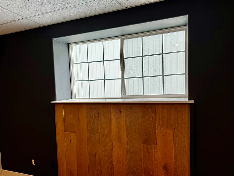 Master Bedroom Window lets in Natural Light... Wood Trimmed Headboard with LED Night Light