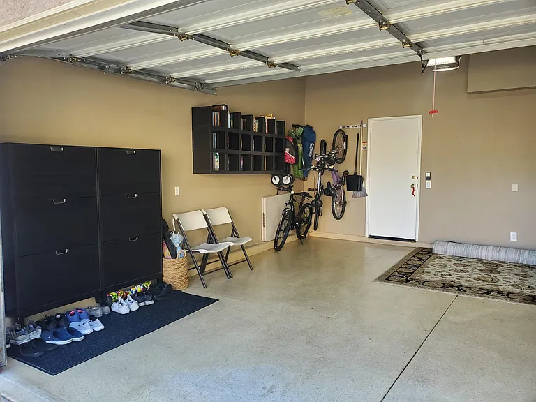 Garage -- with bookshelves and shoe wrack.