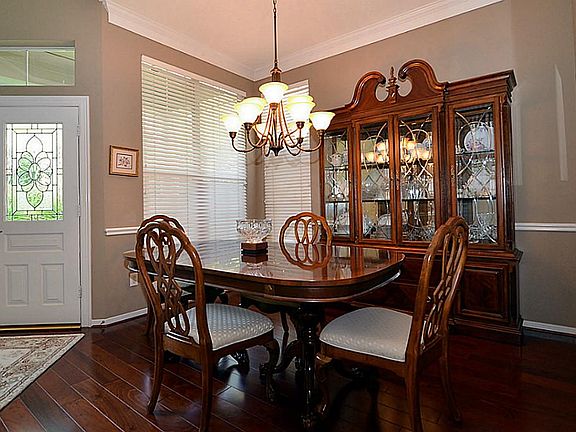 Hardwood flooring throughout the first floor creates a cohesive living space.