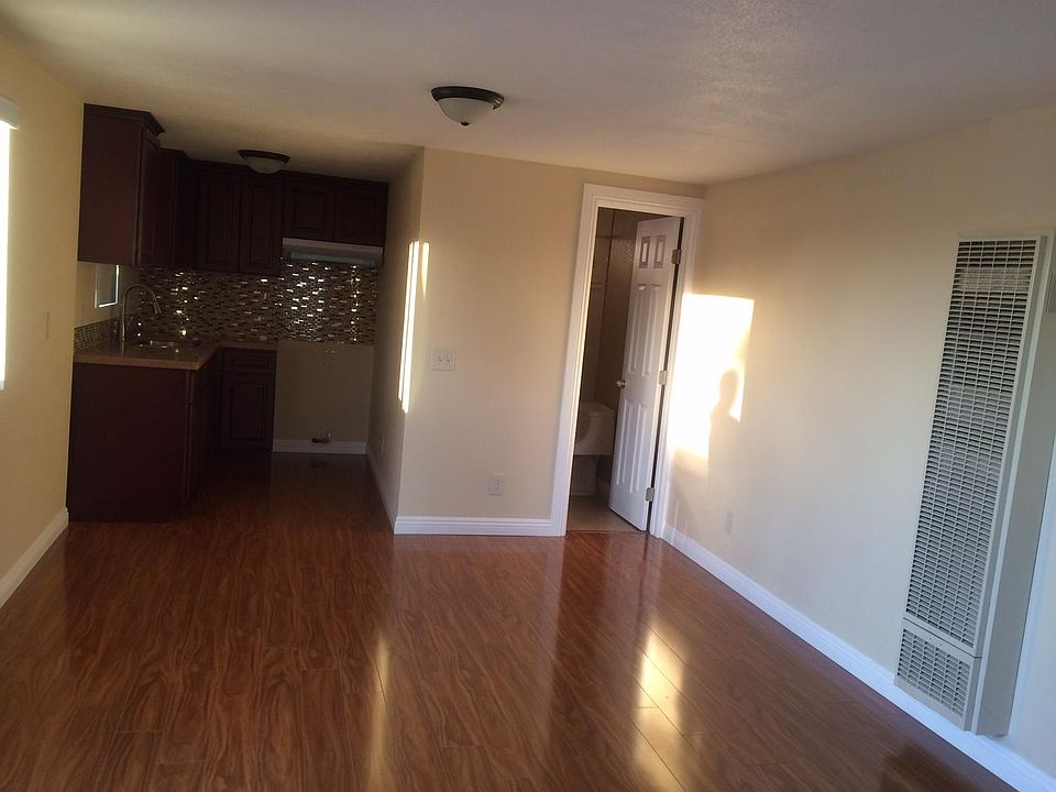 View from entrance. Living room, kitchen and bathroom