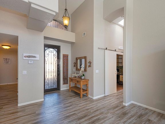 Beautiful front foyer with custom iron door.