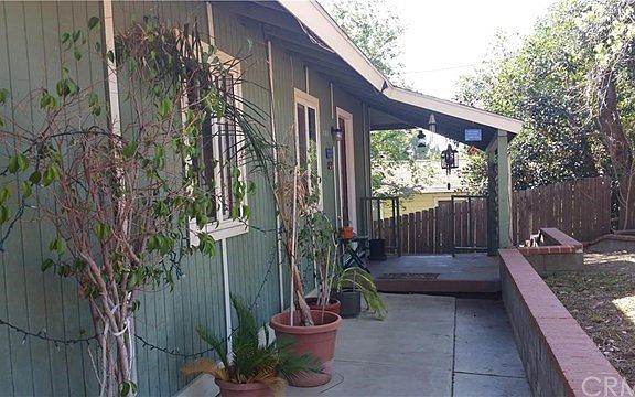 Front of the property is modest and porch is graded away from the house.