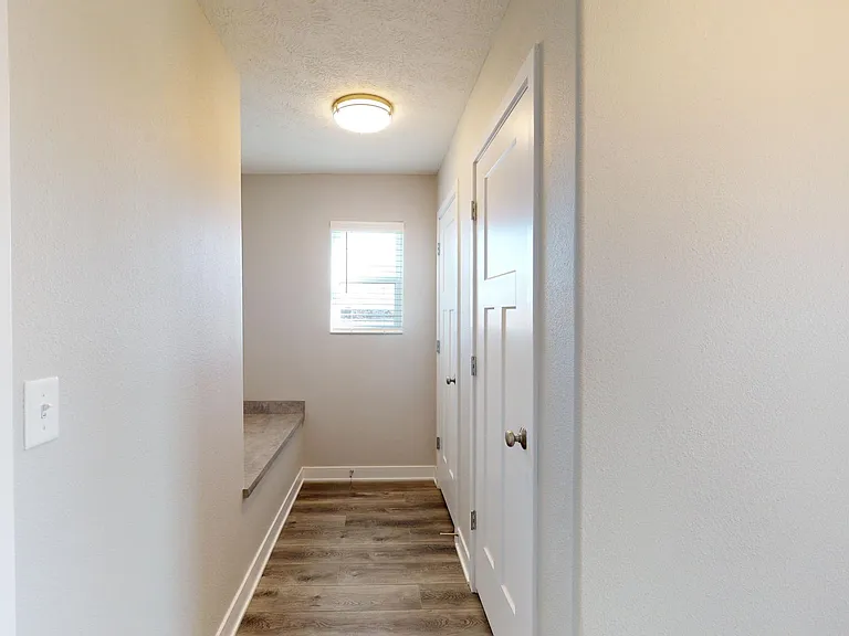 Drop zone off garage with two closets (coat and pantry)