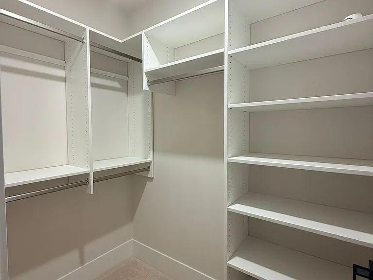 spacious walk-in closet with shelves