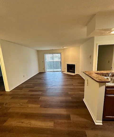 The living room of 2184 B with sliding glass doors to the patio