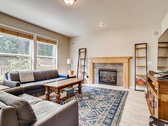 Beautiful family room with built in surround sound speakers and beautiful new laminate floors.