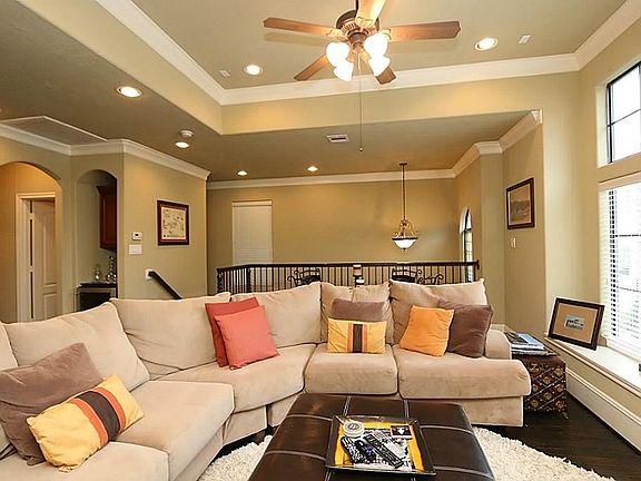 Spacious main living/dining area on the second floor has high ceilings and elegant double crown mold