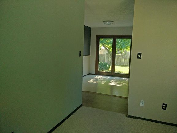 Living room view to eat in kitchen and patio
