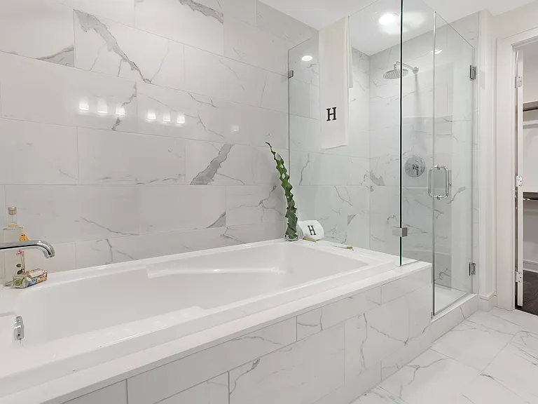 Spa-inspired bathrooms with soaking tubs and walk-in showers