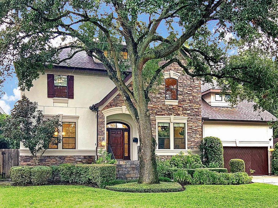 Front Elevation: located on the sought-after block around the corner from Karl Young Park, this dramatic stucco and stone elevat