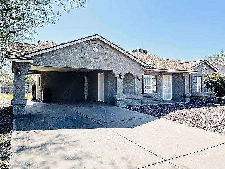 Front of home, double vehicle carport