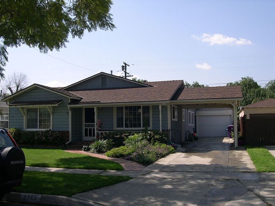 House is now painted Taupe with Green door