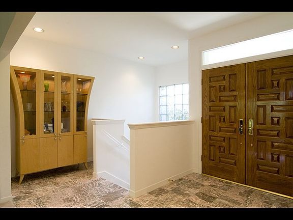 Foyer includes Italian Marble & Mediterranean Red Oak double doors
