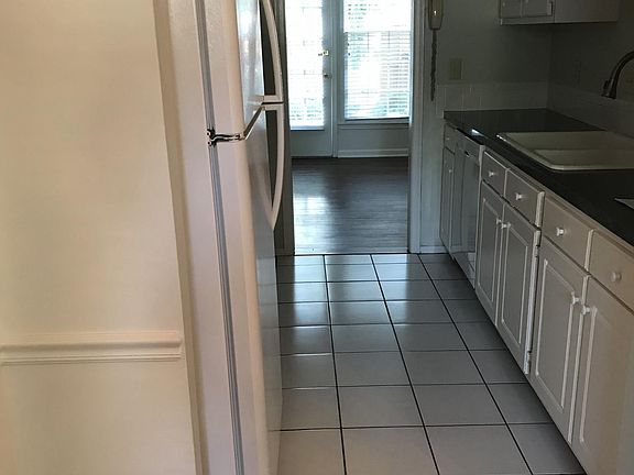 Kitchen with dishwasher, garbage disposal, refrigerator and 