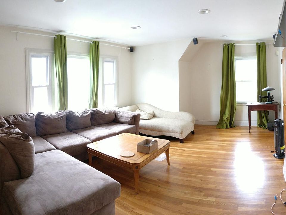 Well lit living room with recessed lighting and beautiful ha
