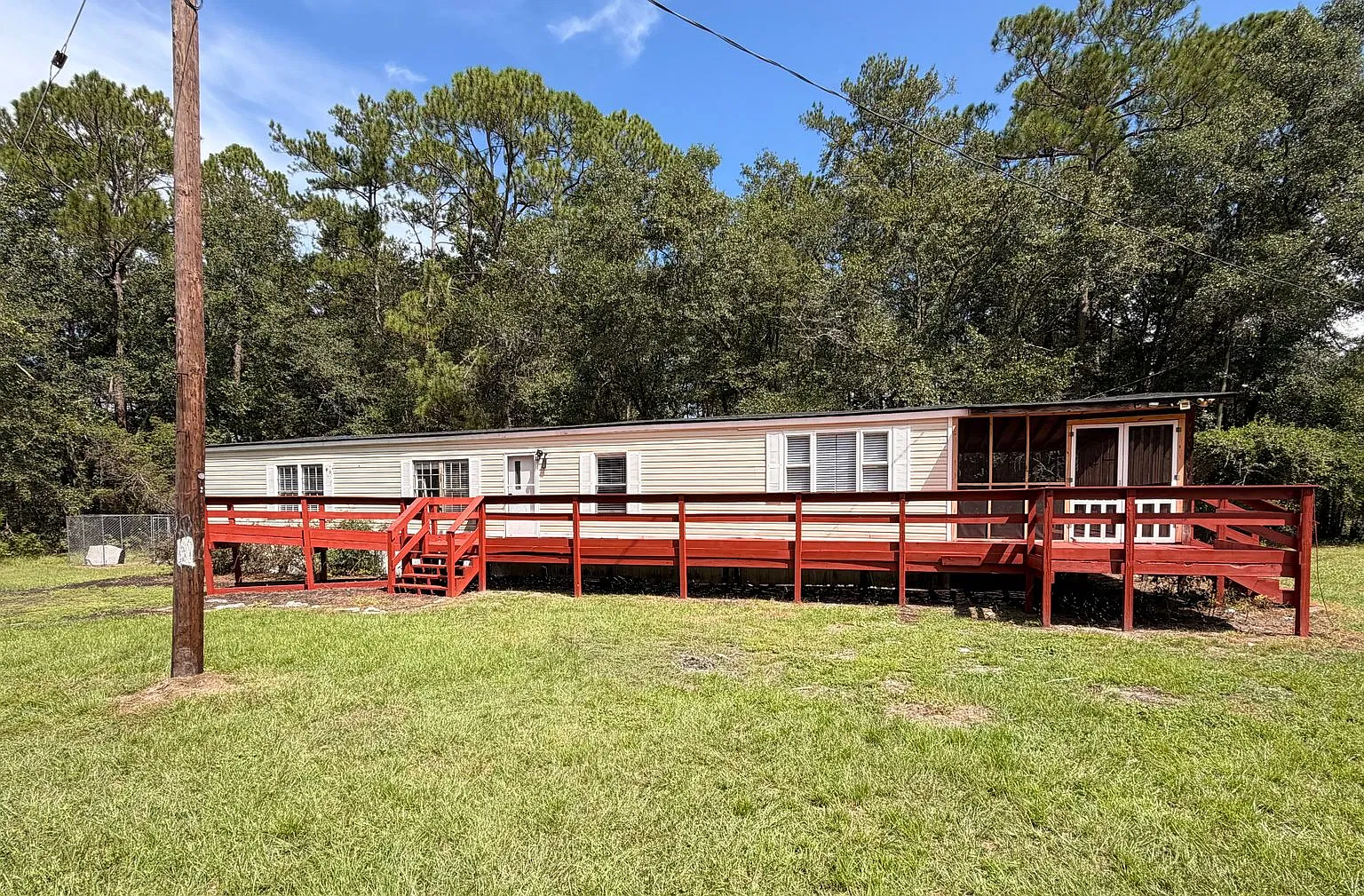 Spacious 4-Bedroom Home on a Private Wooded Lot with Screened Porch $1,900/Month — Photo 1