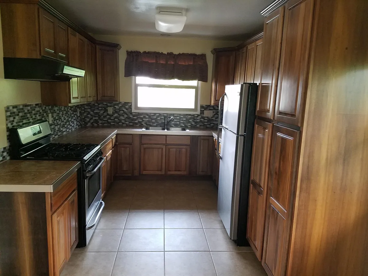Kitchen with range and refrigerator - 236 Palos Verdes Blvd #A