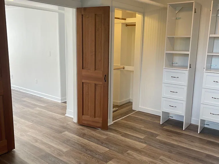 Bedroom entrance, closet. (Additional storage wall unit is currently in office/walk-in closet room but I can be moved back into the bedroom if preferred).