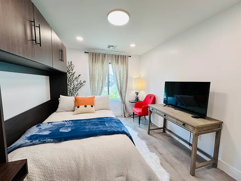 Guest Bedroom 2: 
Versatile Full-size Murphy bed, perfect for maximizing living space during the day.