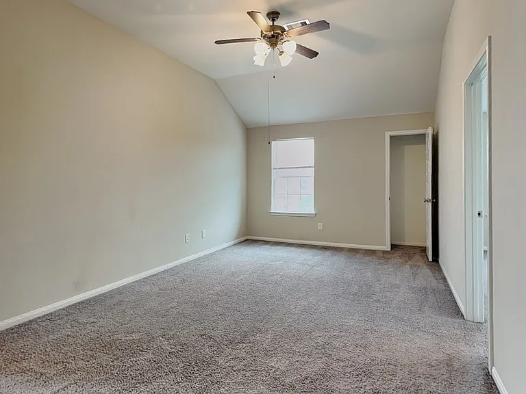 Spacious bedroom with neutral