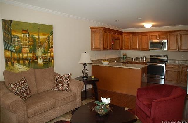 Living with combination dining room opens to kitchen.