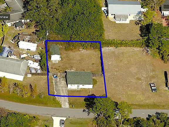 Large partially fenced back yard. Garage/workshop with electric.