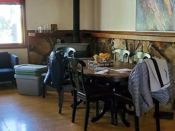 Dining area with wood stove and breakfast bar