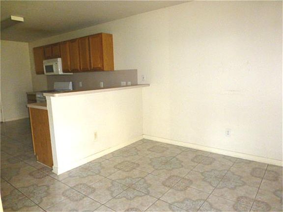 Breakfast Bar separates Breakfast area from kitchen