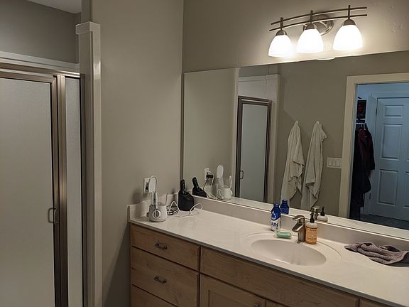 Master bathroom with large walk-in shower. Connected to master bedroom throught large walk-in closet.