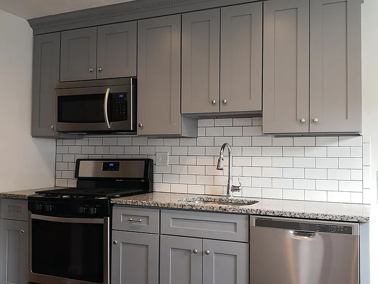 Brand new kitchen with stylish shaker cabinets