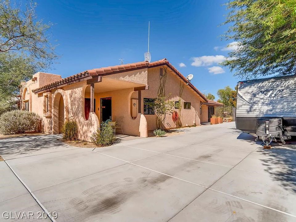 Fabulous Santa Fe style single story home on 1/2 acre lot. RV parking on each side of the home. Heated pool with spa, garden areas. Entertainers delight!