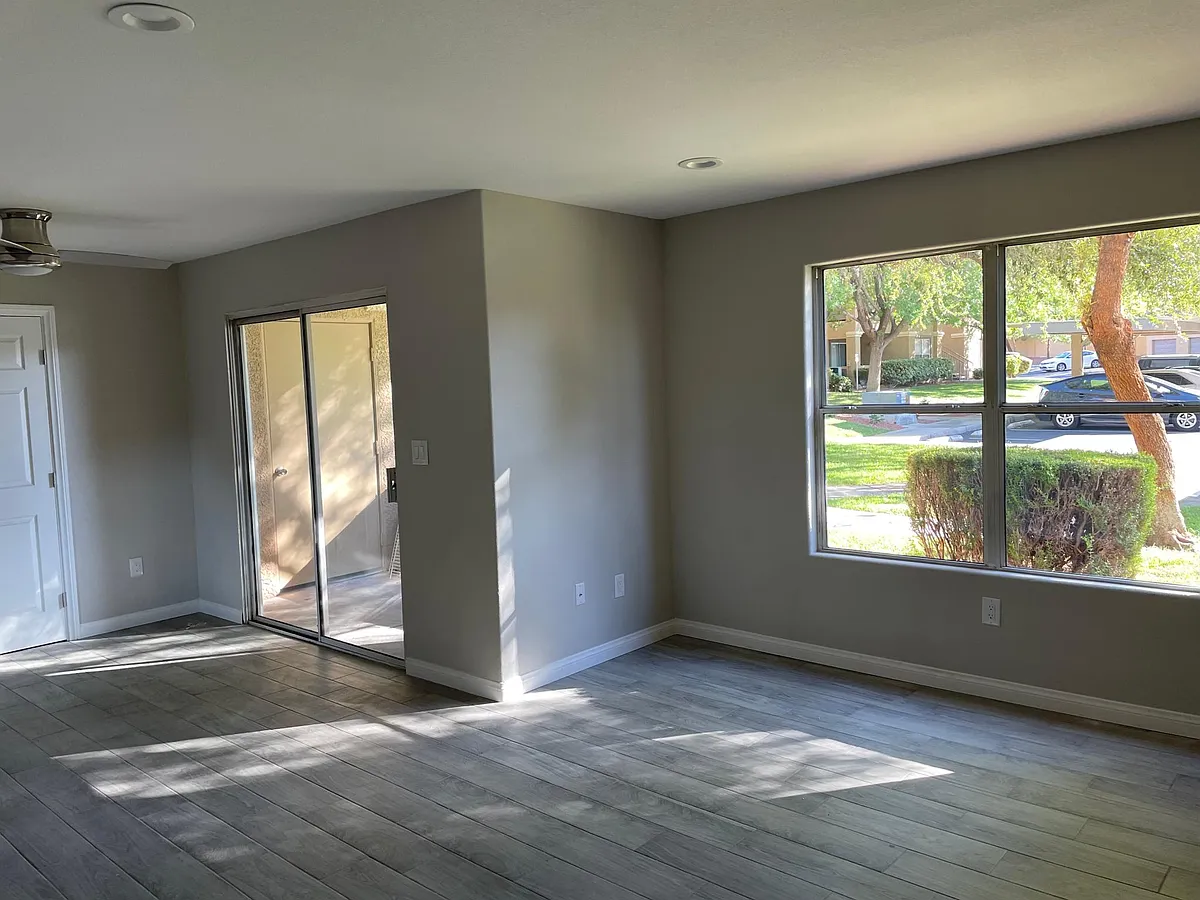Living room and dining. New gray tile and light gray walls - 2300 Silverado Ranch Blvd #1132