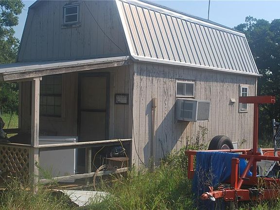 One bed cabin made originally when there was no living quarters there is a sink small kitchenette and bath room in the small cabin