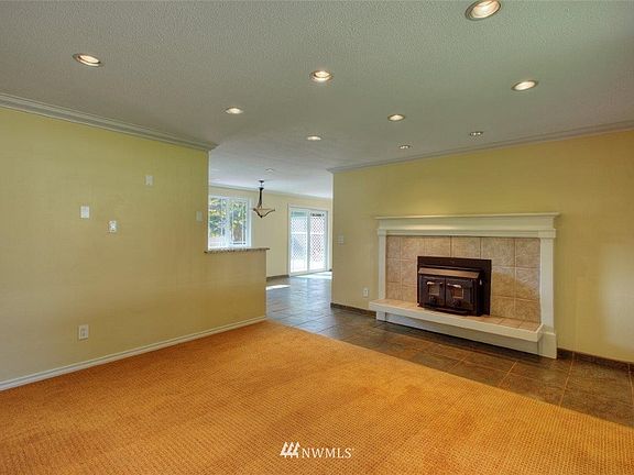 A View from the living area into the dining area. Recessed Lighting.