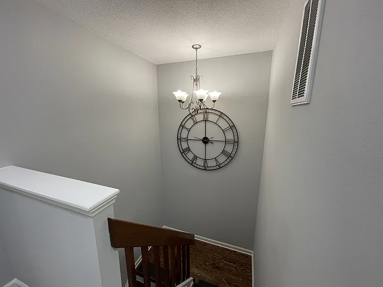 Stairway with chandelier and landing (looking down)