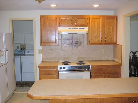 Upgraded cabinets, 1st floor laundry off kitchen.  Breakfast bar.