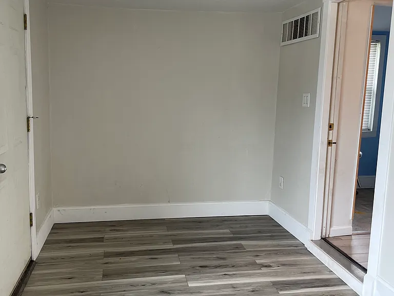 Flexible rear room with great natural light and access to the backyard.