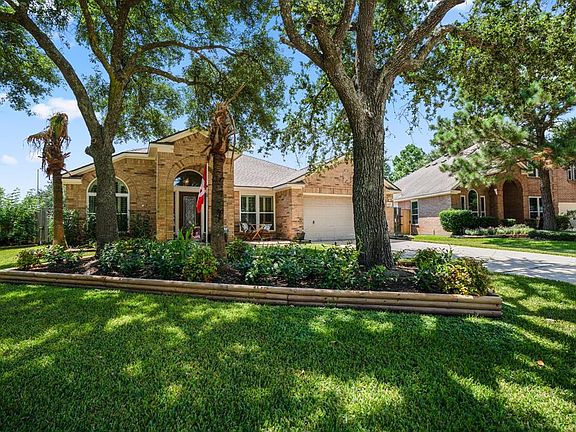 Check out this lovely curb appeal! Mature trees provide an abundance of shade & lush landscaping create a welcoming curb appeal! Some mechanical updates to the home include new AC & water heaters in 2019.