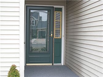Protected front entry with upscale storm door