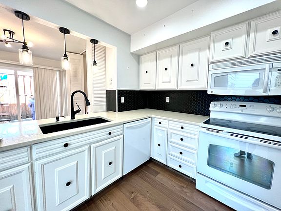 Kitchen with view of patio and breakfast nook