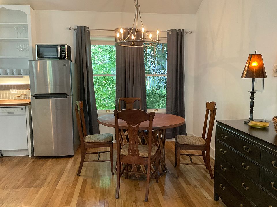 Dining area with Mexican table and antique chairs.