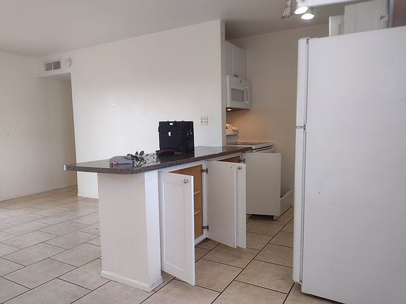 Kitchen... appliances include Stove, Microwave, and fridge.