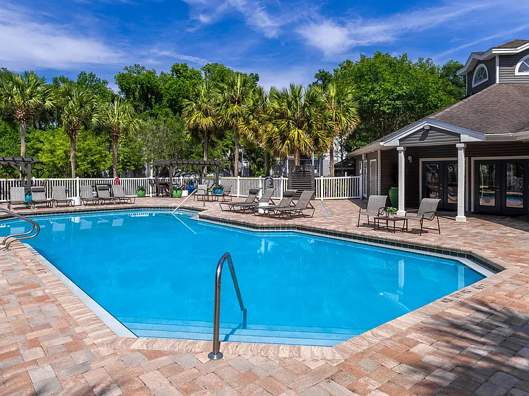 Lounge in luxury at The Enclave's resort-style pool, complete with shaded pergolas and plenty of seating for the perfect day in the sun.
