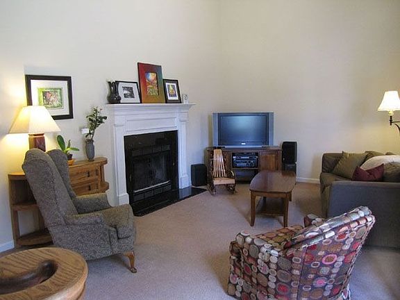 Gas fireplace & new carpeting in Living room.
