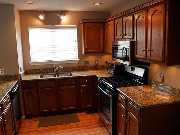 kitchen with granite counters and stainless appliances