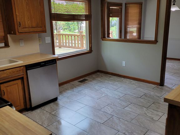 Spacious kitchen with new tile, breakfast nook that leads to dinning room.
