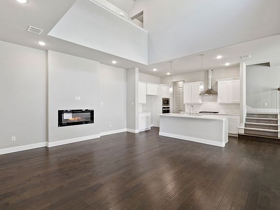 Living room in the Cabernet home plan by Trophy Signature Homes - REPRESENTATIVE PHOTO