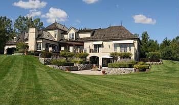 Surrounded by 10 acres of beautifully manicured lawn that captures the view of the Bay Valley golf course, this home is opulent in mood and functional in design and an exceptional home for entertaining.