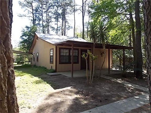 BACK OF HOUSE WITH ANOTHER COVERED PORCH!