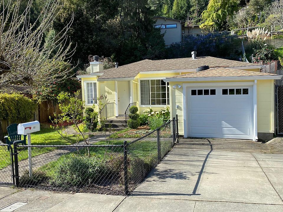 Sunny mid century home with fenced yard and 1 car garage.